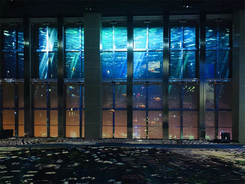OCEAN BY NAKED，create a giant window glass projection still transparent see-through